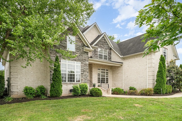 2804 Battleground Dr, Murfreesboro, TN 37129 - traditional home with a front yard, stone siding, brick siding, and roof with shingles