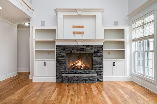 2804 Battleground Dr, Murfreesboro, TN 37129 - detailed view of baseboards, wood finished floors, a stone fireplace, ornamental molding, and built in features