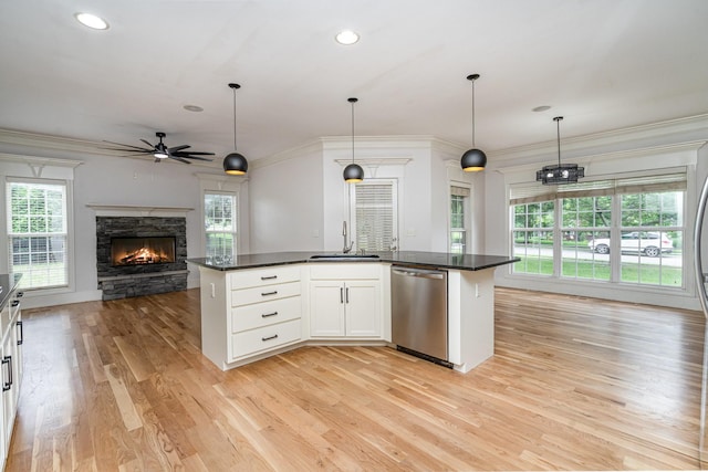 2804 Battleground Dr, Murfreesboro, TN 37129 - kitchen featuring dishwasher, a sink, open floor plan, a ceiling fan, and a fireplace