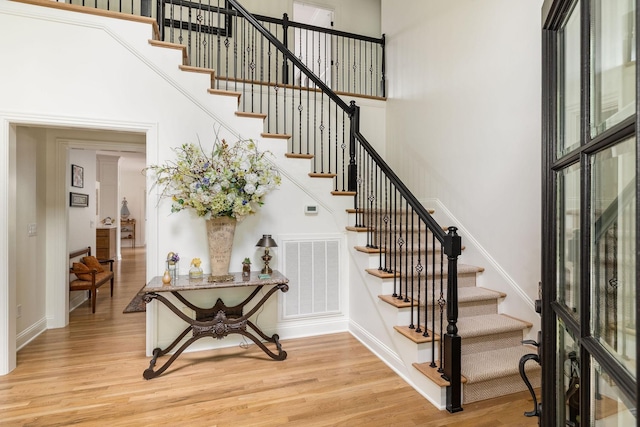 635 Band Dr, Franklin, TN 37064 - staircase featuring wood finished floors, baseboards, and a high ceiling