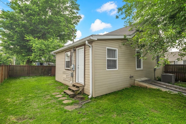 view of side of property with entry steps and central air condition unit