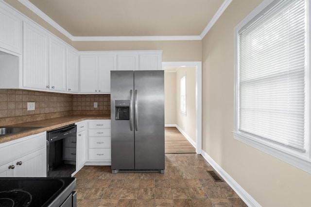 kitchen featuring stainless steel fridge with ice dispenser, dishwasher, white cabinets, stone finish flooring, and decorative backsplash