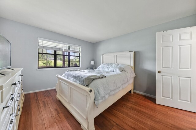 142 Kimberly Rd, Hohenwald, TN 38462 - bedroom with baseboards and dark wood-type flooring