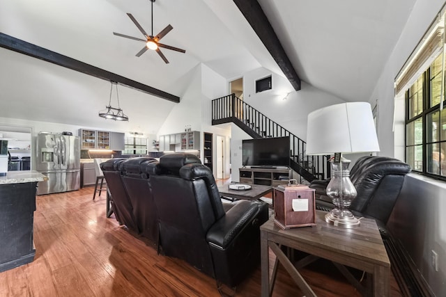 142 Kimberly Rd, Hohenwald, TN 38462 - living area featuring a ceiling fan, light wood-type flooring, high vaulted ceiling, beamed ceiling, and stairway