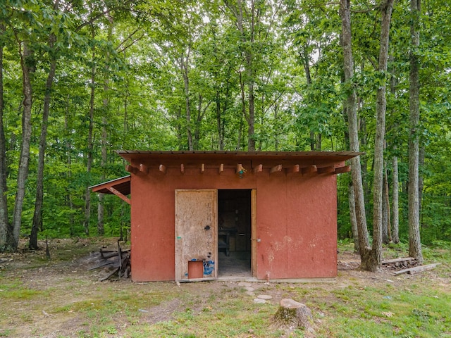 142 Kimberly Rd, Hohenwald, TN 38462 - view of shed featuring a view of trees