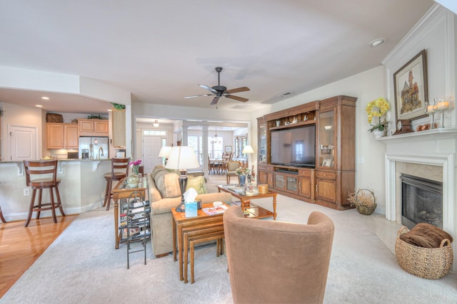 living room featuring ceiling fan, a fireplace, and recessed lighting