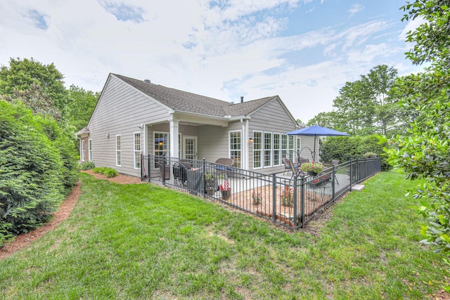 rear view of property featuring a patio area