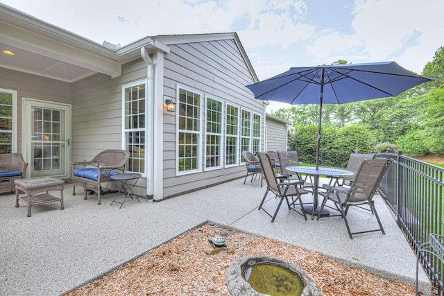 view of patio featuring outdoor dining area