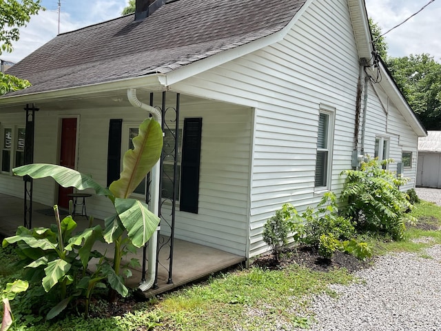 618 E Vine St, Murfreesboro, TN 37130 - view of side of property with roof with shingles and a chimney