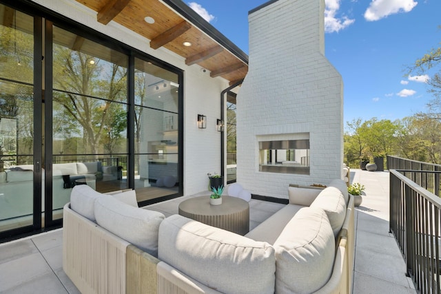 9052 Passiflora Ct, College Grove, TN 37046 - view of patio with an outdoor living space with a fireplace