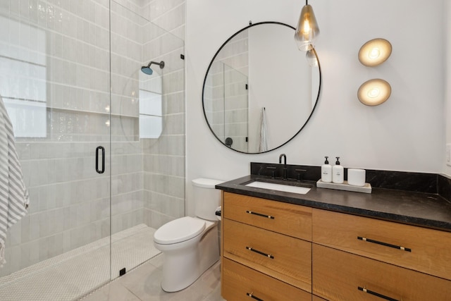 9052 Passiflora Ct, College Grove, TN 37046 - bathroom with a shower stall, vanity, toilet, and tile patterned floors