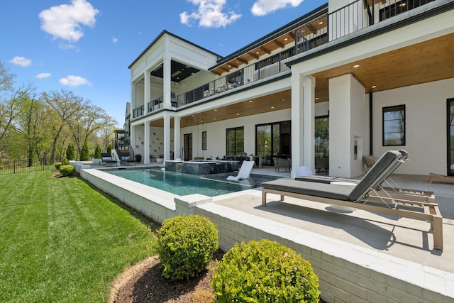 9052 Passiflora Ct, College Grove, TN 37046 - back of property with a balcony, a patio, an infinity pool, and a hot tub