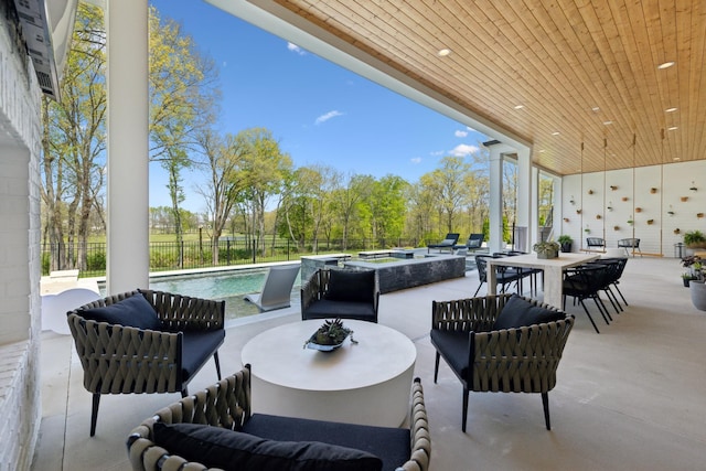 9052 Passiflora Ct, College Grove, TN 37046 - view of patio / terrace featuring an outdoor hangout area, outdoor dining space, fence, and view of wooded area