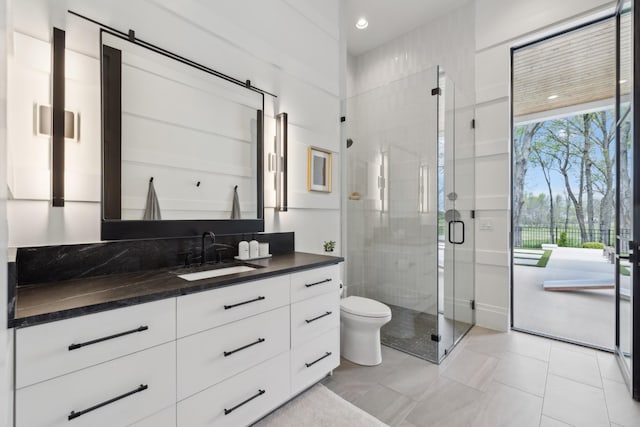 9052 Passiflora Ct, College Grove, TN 37046 - bathroom with a stall shower, vanity, and toilet