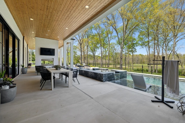 9052 Passiflora Ct, College Grove, TN 37046 - view of patio / terrace with a fenced backyard, a pool with connected hot tub, and outdoor dining area
