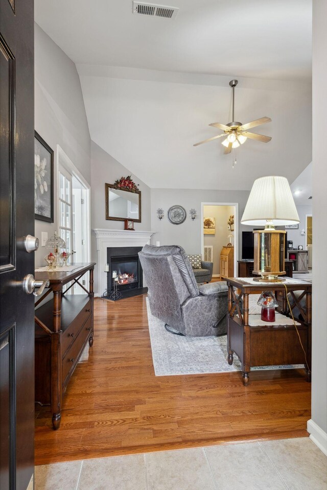 825 S Browns Ln Unit 1501, Gallatin, TN 37066 - tiled living area with a glass covered fireplace, ceiling fan, and lofted ceiling