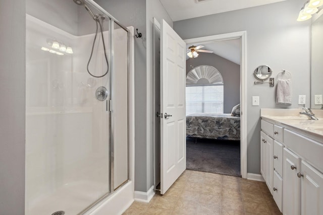 825 S Browns Ln Unit 1501, Gallatin, TN 37066 - ensuite bathroom with a stall shower, ceiling fan, vaulted ceiling, vanity, and baseboards