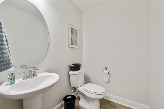 362 Savoy Loop, Nolensville, TN 37135 - half bathroom with baseboards, toilet, a sink, and wood finished floors