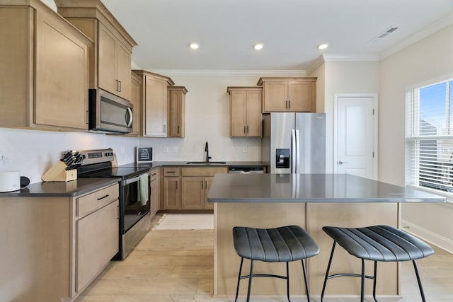 362 Savoy Loop, Nolensville, TN 37135 - kitchen with stainless steel appliances, a sink, dark countertops, crown molding, and a kitchen breakfast bar