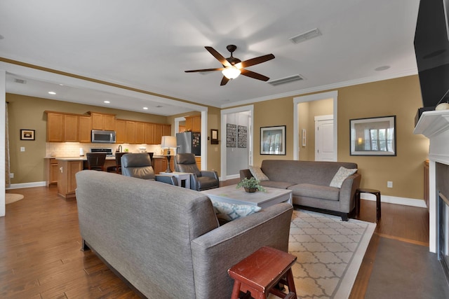 606 Tywater Crossing Blvd, Franklin, TN 37064 - living room featuring ceiling fan, baseboards, wood finished floors, a fireplace, and recessed lighting