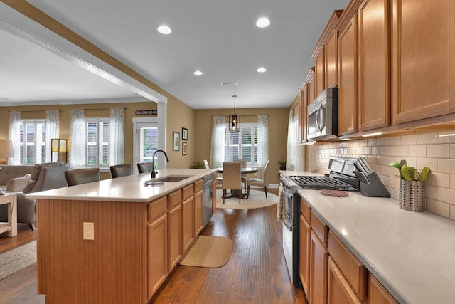 606 Tywater Crossing Blvd, Franklin, TN 37064 - kitchen featuring stainless steel appliances, a sink, dark wood-style flooring, open floor plan, and light countertops