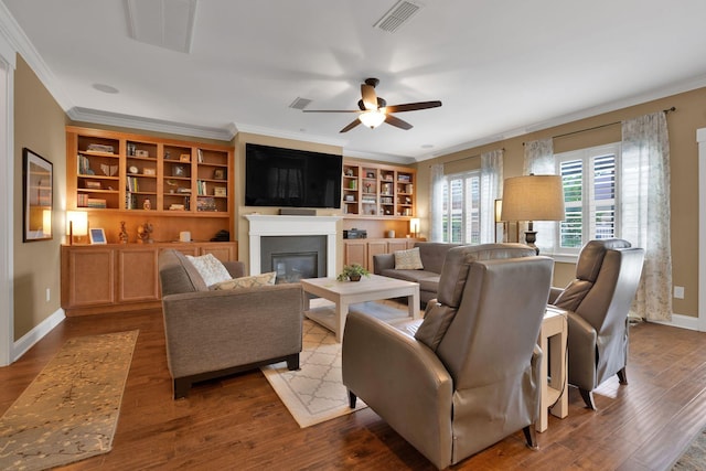 606 Tywater Crossing Blvd, Franklin, TN 37064 - living room with ornamental molding, ceiling fan, a glass covered fireplace, wood finished floors, and baseboards