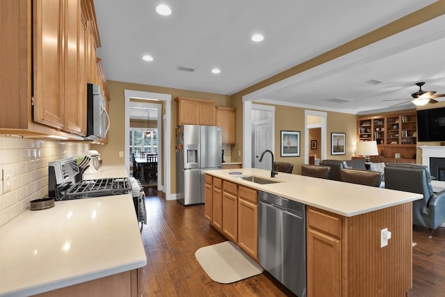 606 Tywater Crossing Blvd, Franklin, TN 37064 - kitchen with stainless steel appliances, a sink, ceiling fan, light countertops, and decorative backsplash