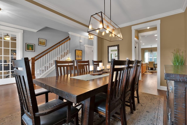 606 Tywater Crossing Blvd, Franklin, TN 37064 - dining area with wood finished floors, ornamental molding, and stairs