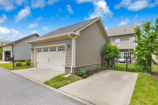606 Tywater Crossing Blvd, Franklin, TN 37064 - view of side of property featuring brick siding, driveway, a garage, and roof with shingles