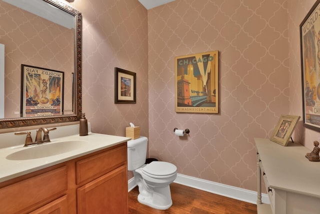 606 Tywater Crossing Blvd, Franklin, TN 37064 - bathroom with wood finished floors, vanity, toilet, baseboards, and wallpapered walls