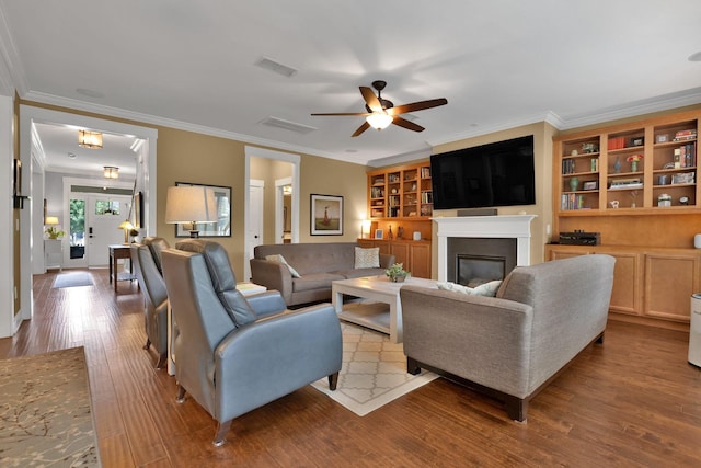 606 Tywater Crossing Blvd, Franklin, TN 37064 - living room with ceiling fan, wood finished floors, a glass covered fireplace, and crown molding