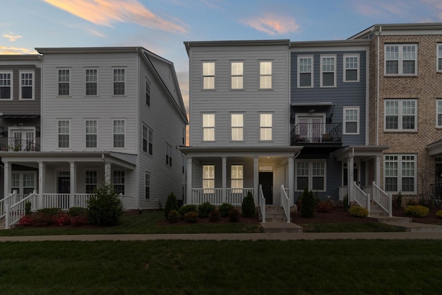 148 Burkitt Commons Ave, Nolensville, TN 37135 - townhome / multi-family property featuring covered porch and a lawn