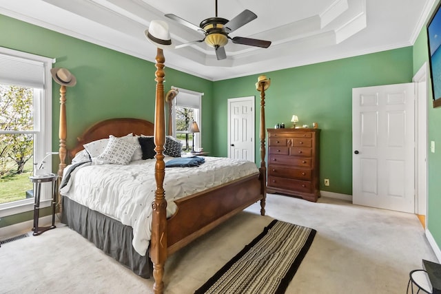 2926 Lisa Dr, Springfield, TN 37172 - carpeted bedroom with a tray ceiling, crown molding, a closet, baseboards, and ceiling fan