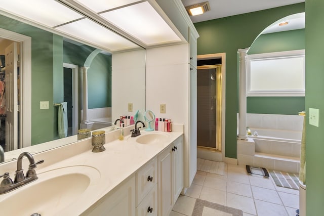 2926 Lisa Dr, Springfield, TN 37172 - full bath featuring tile patterned floors, a stall shower, a bath, and double vanity