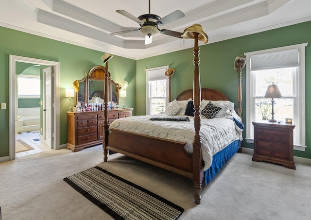 2926 Lisa Dr, Springfield, TN 37172 - carpeted bedroom with a raised ceiling, crown molding, ensuite bathroom, baseboards, and a ceiling fan