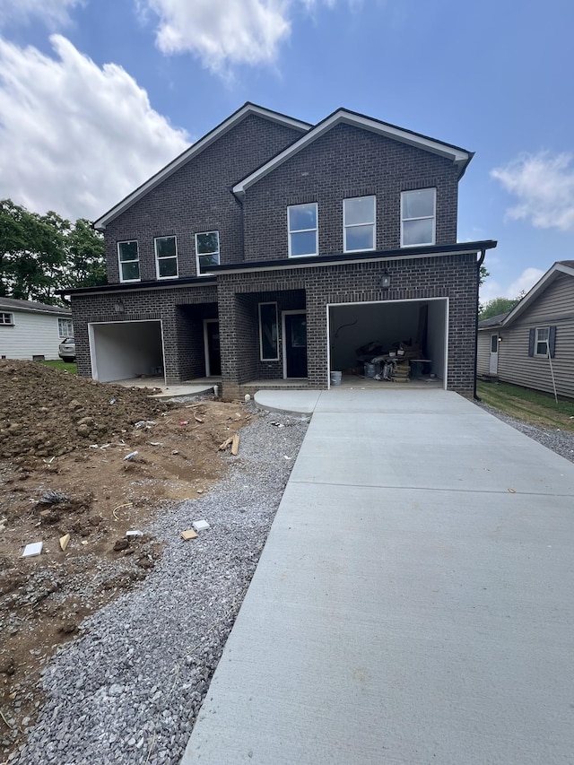 507 Demoss St Unit 110, Gallatin, TN 37066 - view of front of property with driveway, brick siding, and a garage