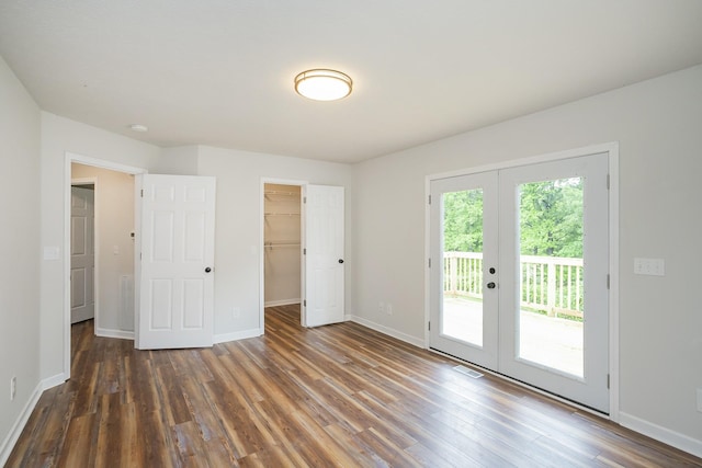 1011 Bon Meade Dr, Burns, TN 37029 - unfurnished bedroom with french doors, access to exterior, wood finished floors, and baseboards