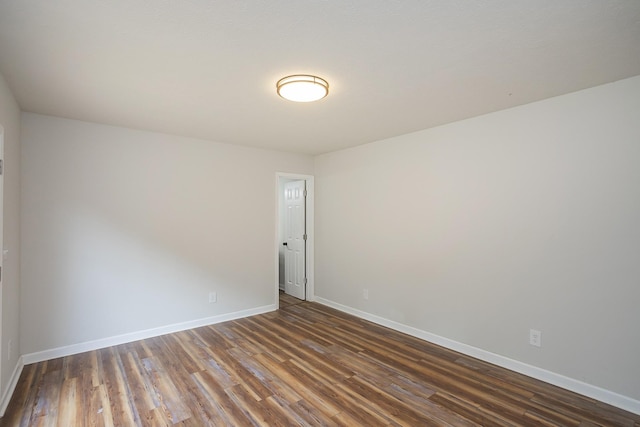 1011 Bon Meade Dr, Burns, TN 37029 - unfurnished room with dark wood-type flooring and baseboards