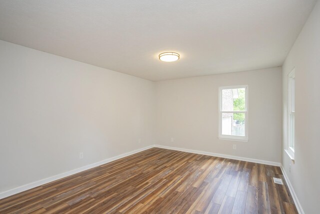 1011 Bon Meade Dr, Burns, TN 37029 - unfurnished room featuring dark wood-style floors and baseboards