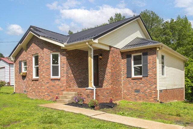 1011 Bon Meade Dr, Burns, TN 37029 - view of front of house featuring brick siding, crawl space, a front yard, and metal roof