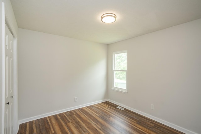 1011 Bon Meade Dr, Burns, TN 37029 - unfurnished room with dark wood-type flooring and baseboards