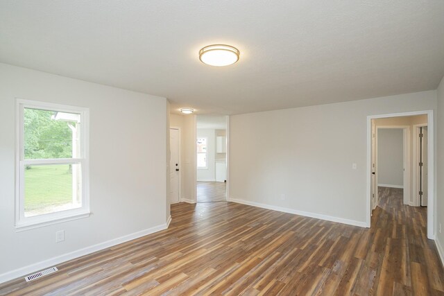 1011 Bon Meade Dr, Burns, TN 37029 - empty room featuring wood finished floors, baseboards, and plenty of natural light