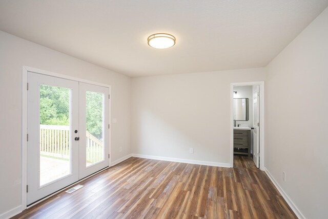1011 Bon Meade Dr, Burns, TN 37029 - unfurnished room featuring wood finished floors, french doors, and baseboards