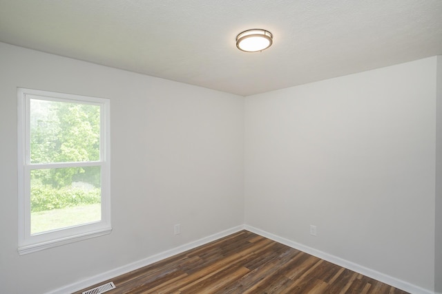 1011 Bon Meade Dr, Burns, TN 37029 - unfurnished room with dark wood-style floors and baseboards