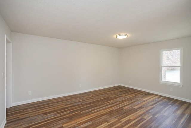 1011 Bon Meade Dr, Burns, TN 37029 - spare room with dark wood-type flooring and baseboards