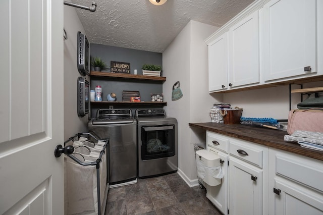 3307 Stormello Ln, Murfreesboro, TN 37128 - clothes washing area featuring washing machine and clothes dryer, cabinet space, baseboards, and a textured ceiling