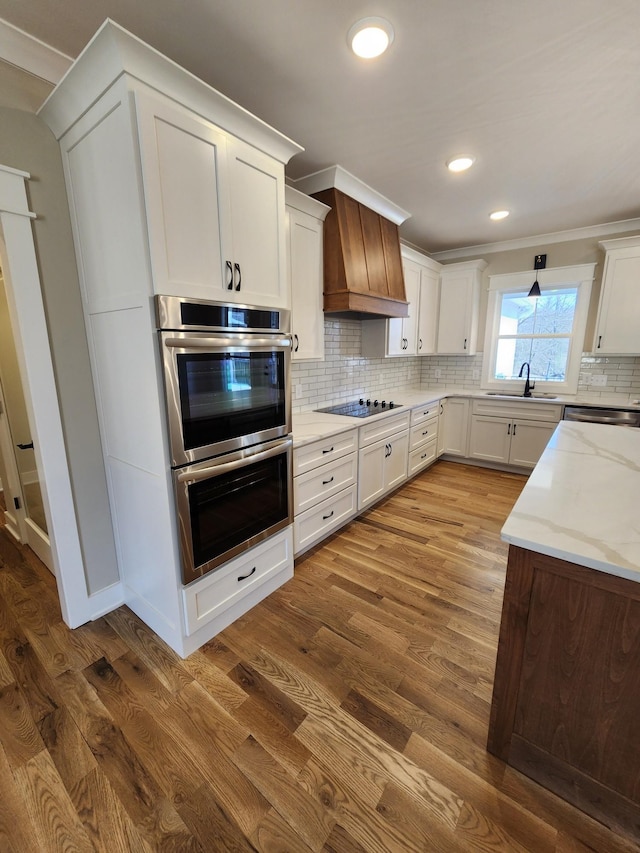 240 S Tunnel Rd, Portland, TN 37148 - kitchen with stainless steel appliances, custom exhaust hood, light stone counters, dark wood finished floors, and decorative backsplash
