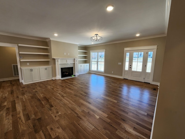 240 S Tunnel Rd, Portland, TN 37148 - unfurnished living room with ornamental molding, dark wood-type flooring, built in shelves, baseboards, and recessed lighting