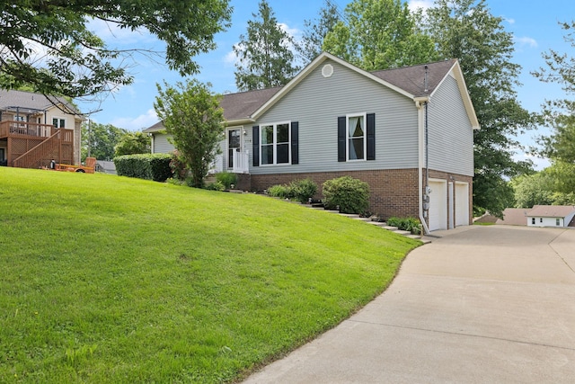 114 Clover Dr, Columbia, TN 38401 - single story home featuring brick siding, concrete driveway, a garage, and a front yard