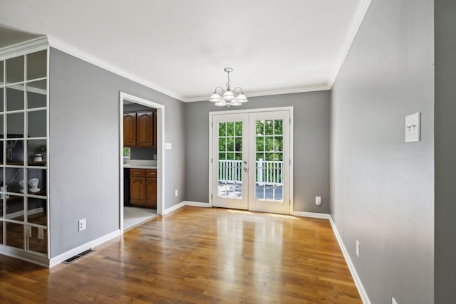 114 Clover Dr, Columbia, TN 38401 - unfurnished dining area featuring a chandelier, light wood finished floors, crown molding, french doors, and baseboards